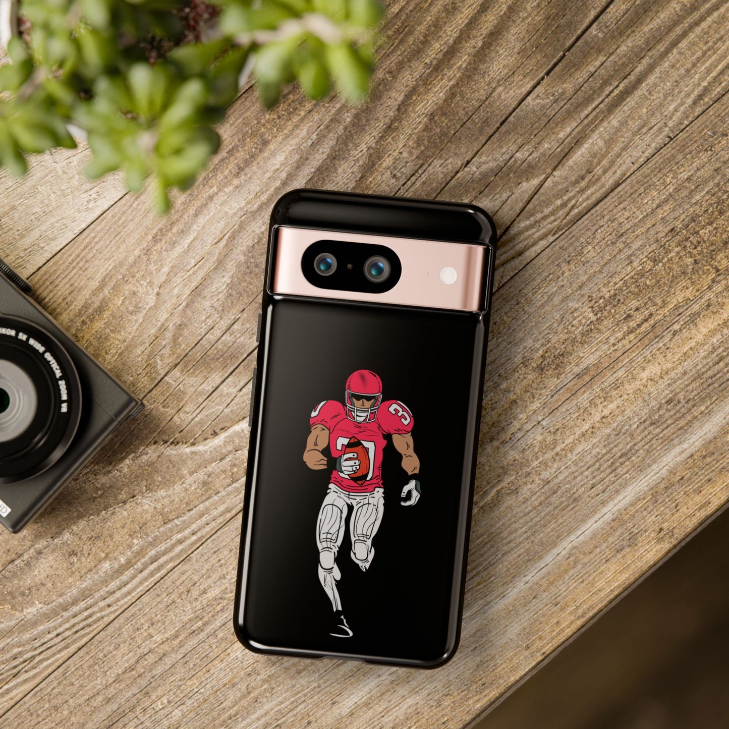 Black sports phone case featuring a football player design, designed for iPhone, provides durable protection and a sporty look.