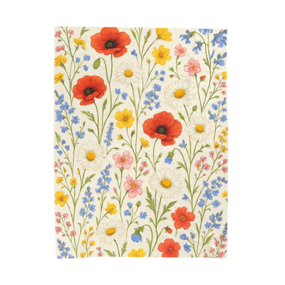 Velveteen plush blanket with all-over print of poppy daisies and wildflowers, featuring a vibrant wildflower meadow design.