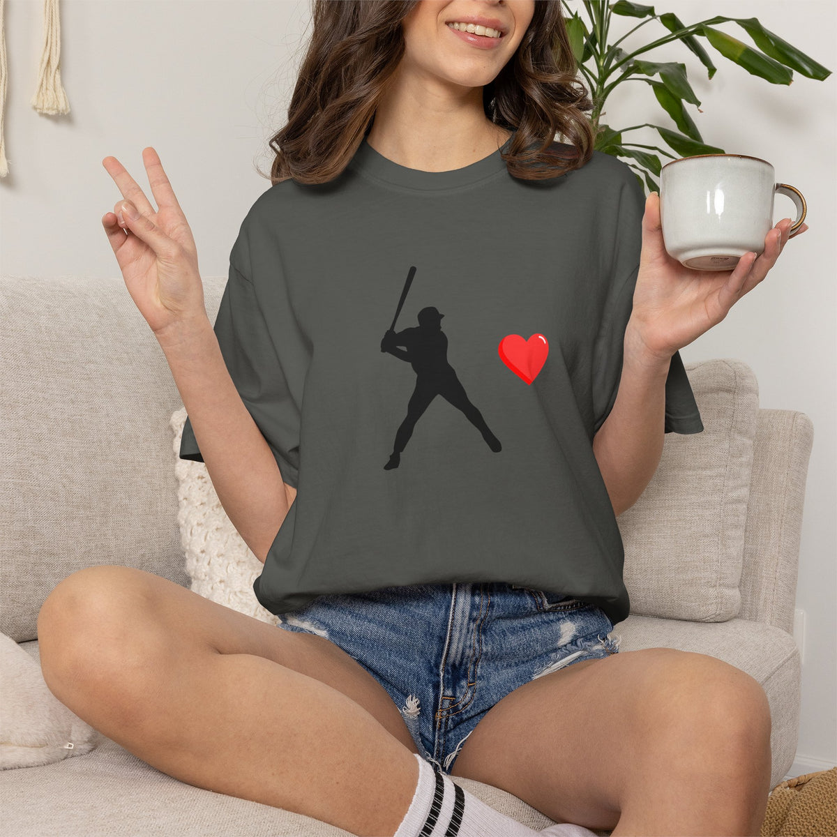 White baseball batter heart T-shirt by Printify featuring a graphic of a batter with a heart motif on the front.