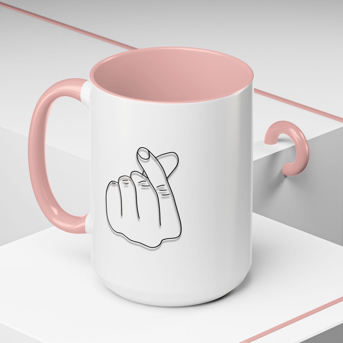 White ceramic coffee mug with minimal Korean finger heart accent design, 11oz, by Printify, shown with a close-up of the heart detail.