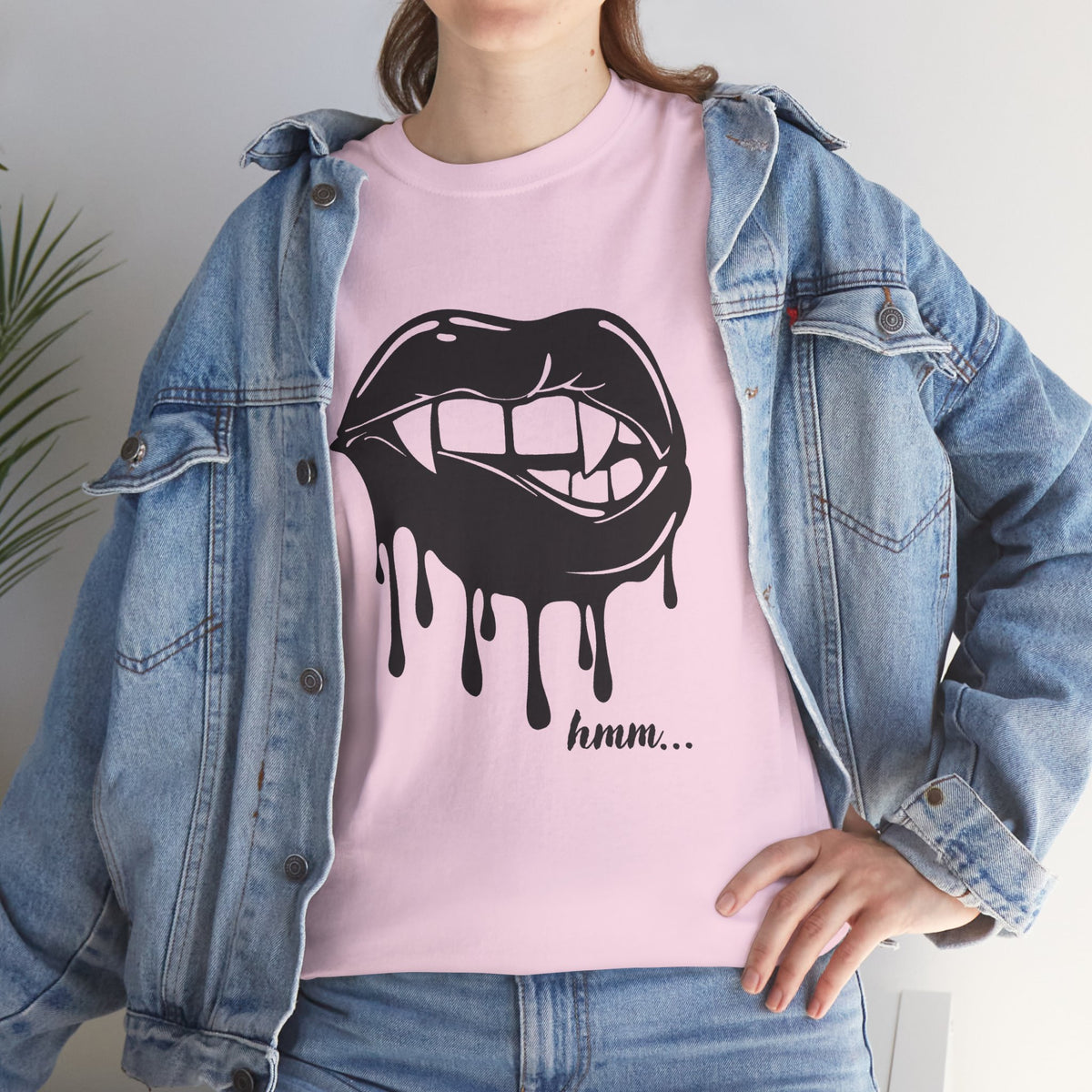 Black graphic t-shirt featuring dripping lips with a 'hmm...' bite design, by Printify, showcasing bold, artistic print on the front.