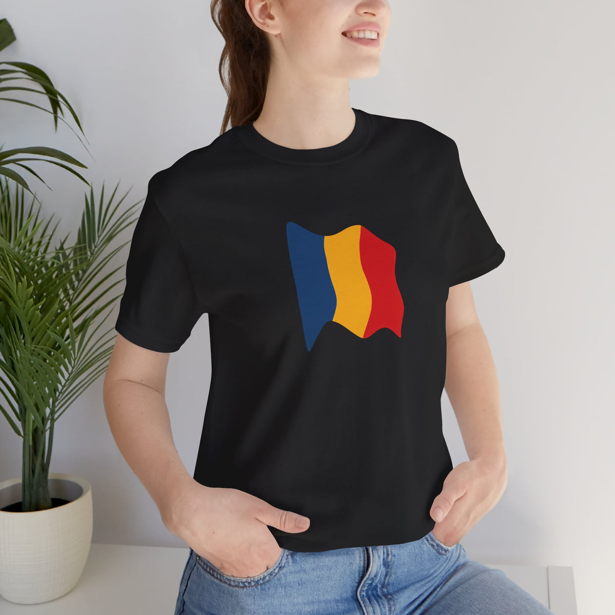 Romania flag T-shirt by Printify featuring a minimal waving tricolor design on a casual tee.