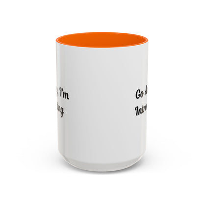 Ceramic coffee mug with "Go Away, I'm Introverting" quote in black text, 11 oz size, by Printify.