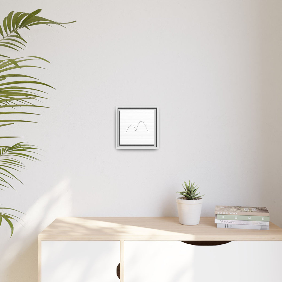 Framed matte canvas featuring minimalist mountain line art by Printify, showcasing simple black mountain outline on white background.