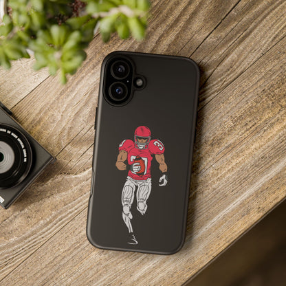 Black football player tough phone case for iPhone, protective sports-themed case by Printify featuring athletic design.