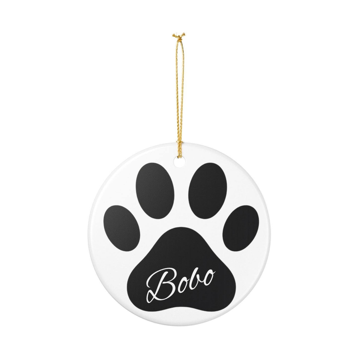 Black paw print ceramic ornament with pet's name, ideal for memorial Christmas decoration, from Printify.