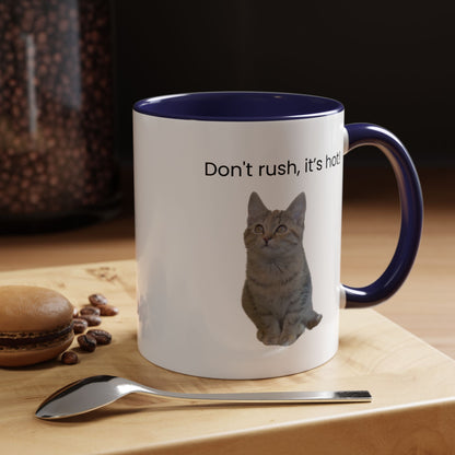 Ceramic cat coffee mug with "Don't rush, it's hot!" message in 11 oz size, featuring a playful cat illustration.