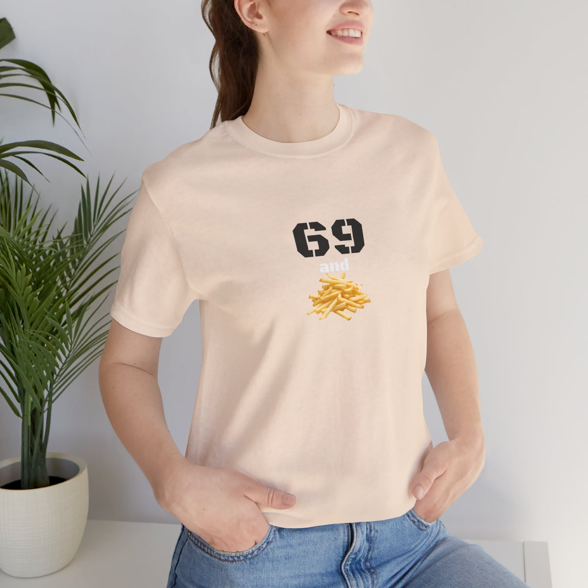 Unisex graphic T-shirt featuring a humorous 69 and French fries design in bold print, perfect for casual wear.
