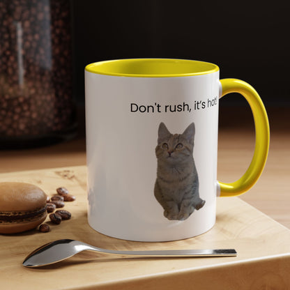 Ceramic cat-themed coffee mug with "Don't rush, it's hot!" text in 11 oz size, featuring a playful design.