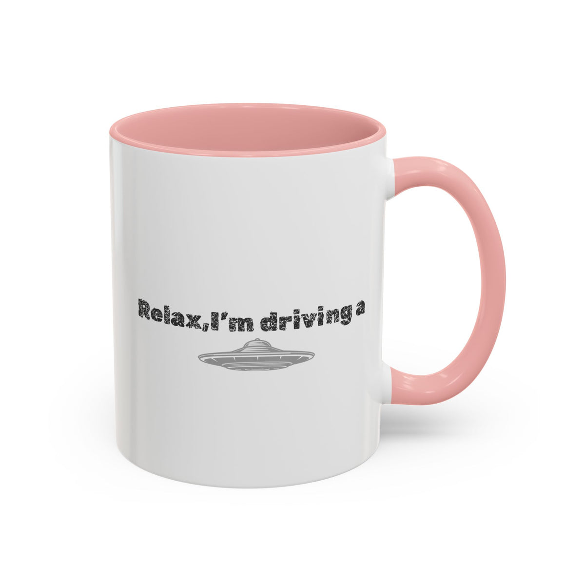 Ceramic coffee mug with "Relax, I’m Driving" slogan and UFO accent design, available in 11 or 15 oz sizes.