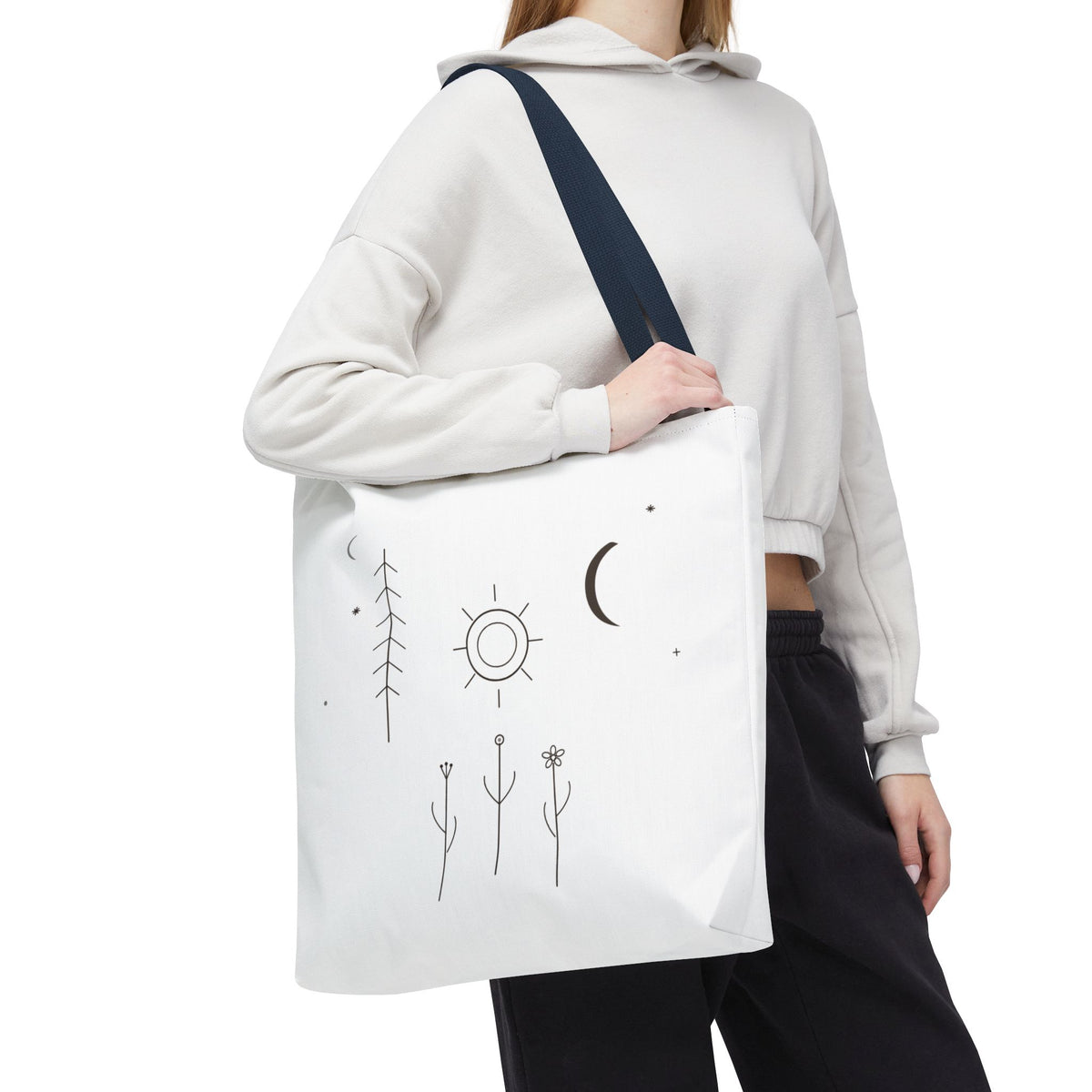 Minimal Moon and Sun botanical tote bag with celestial line art design, printed by Printify, featuring natural botanical motifs.