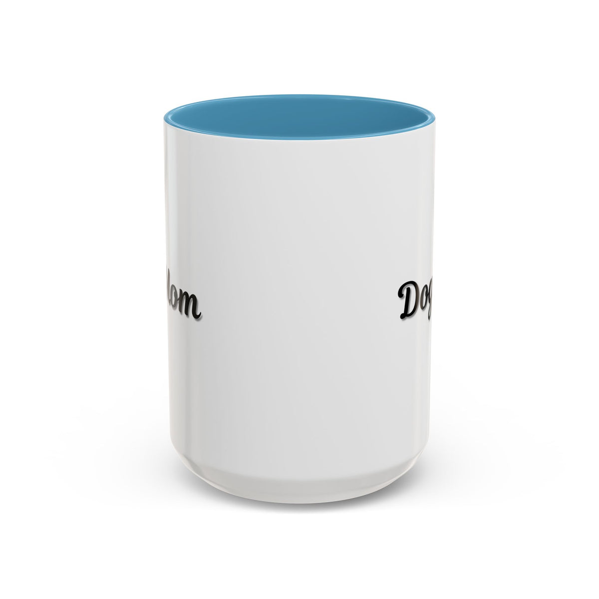 Dog Mom Accent Coffee Mug — white ceramic coffee mug with retro script "Dog Mom" print, colored interior and C-handle, 11oz/15oz, angled view on wooden table
