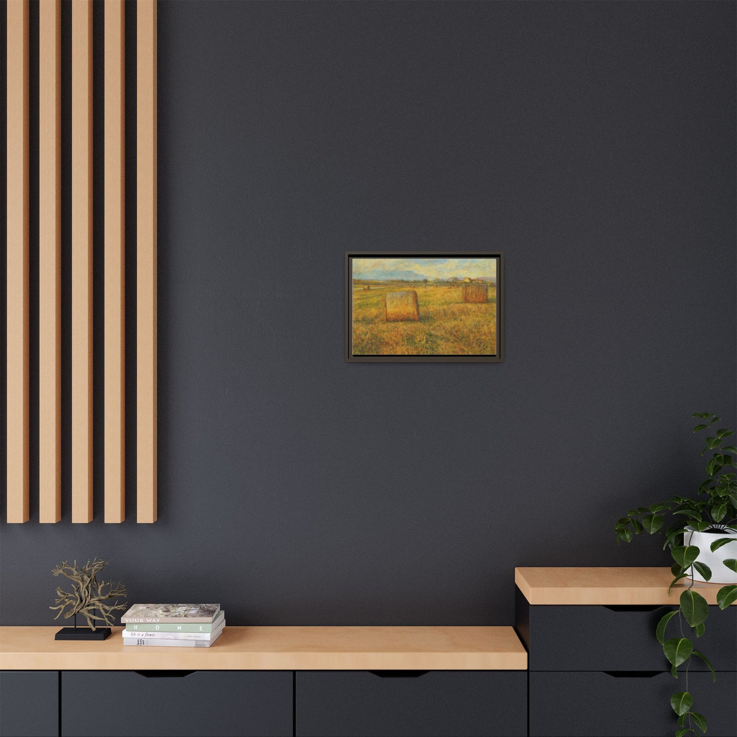 Framed matte canvas wall art featuring a rustic hayfield landscape print by Printify.
