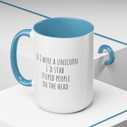 Funny ceramic mug featuring a unicorn design and humorous text about stabbing stupid people, by Printify.