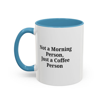 Ceramic coffee mug with "Not a Morning Person, Just a Coffee Person" printed in black text on white background