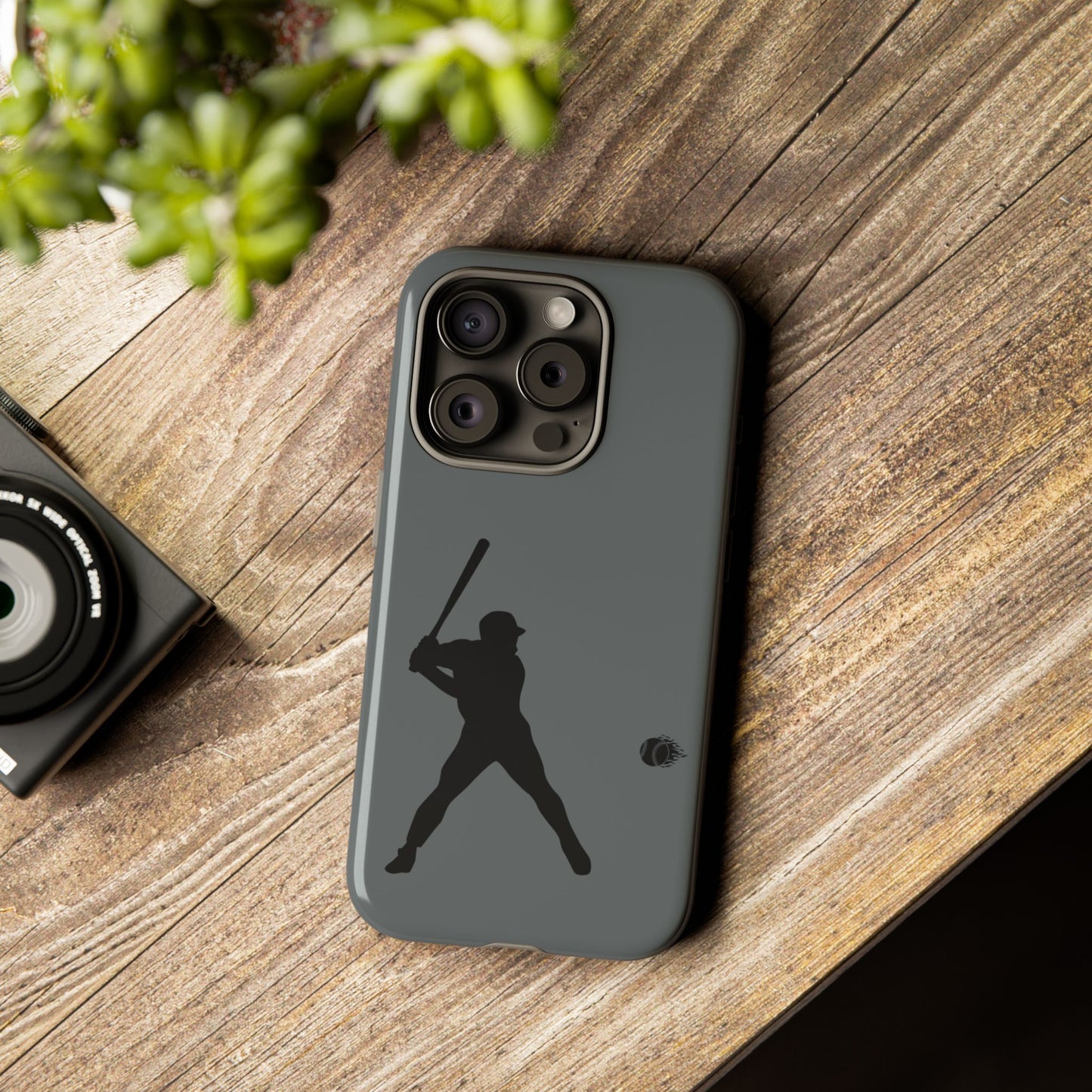 Black phone case with a white baseball silhouette design, protective sporty iPhone cover by Printify.