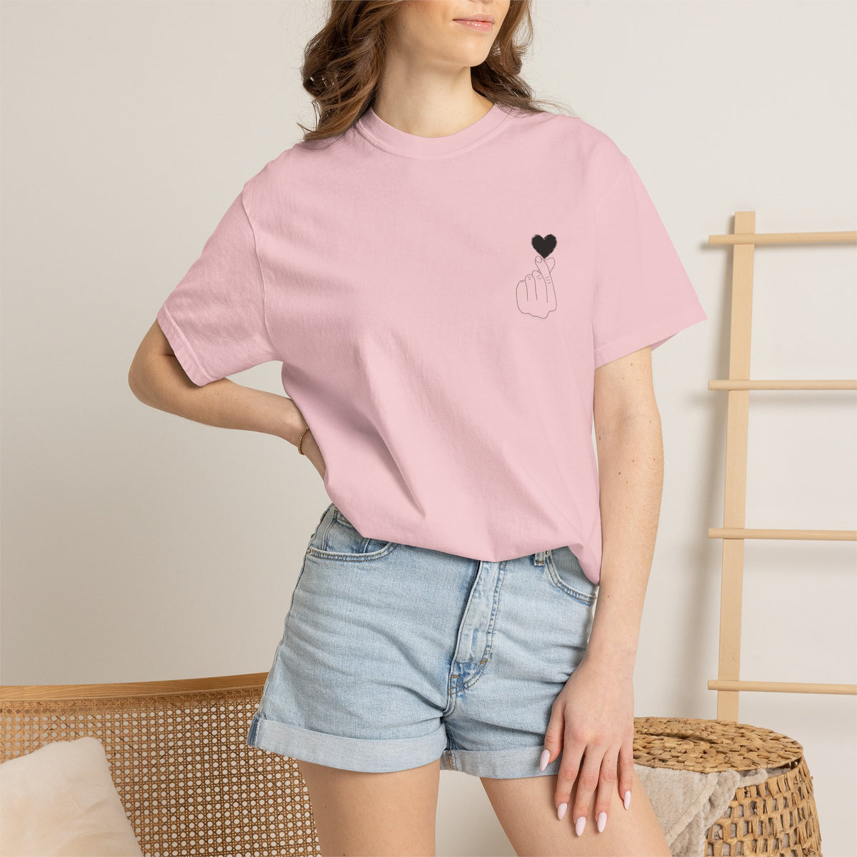 Black T-shirt with minimal white finger heart graphic from Printify, casual men's or women's graphic tee.