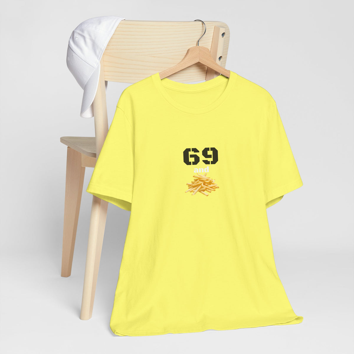 Unisex graphic T-shirt featuring a humorous 69 and French Fries design, colorful print on a casual cotton tee.