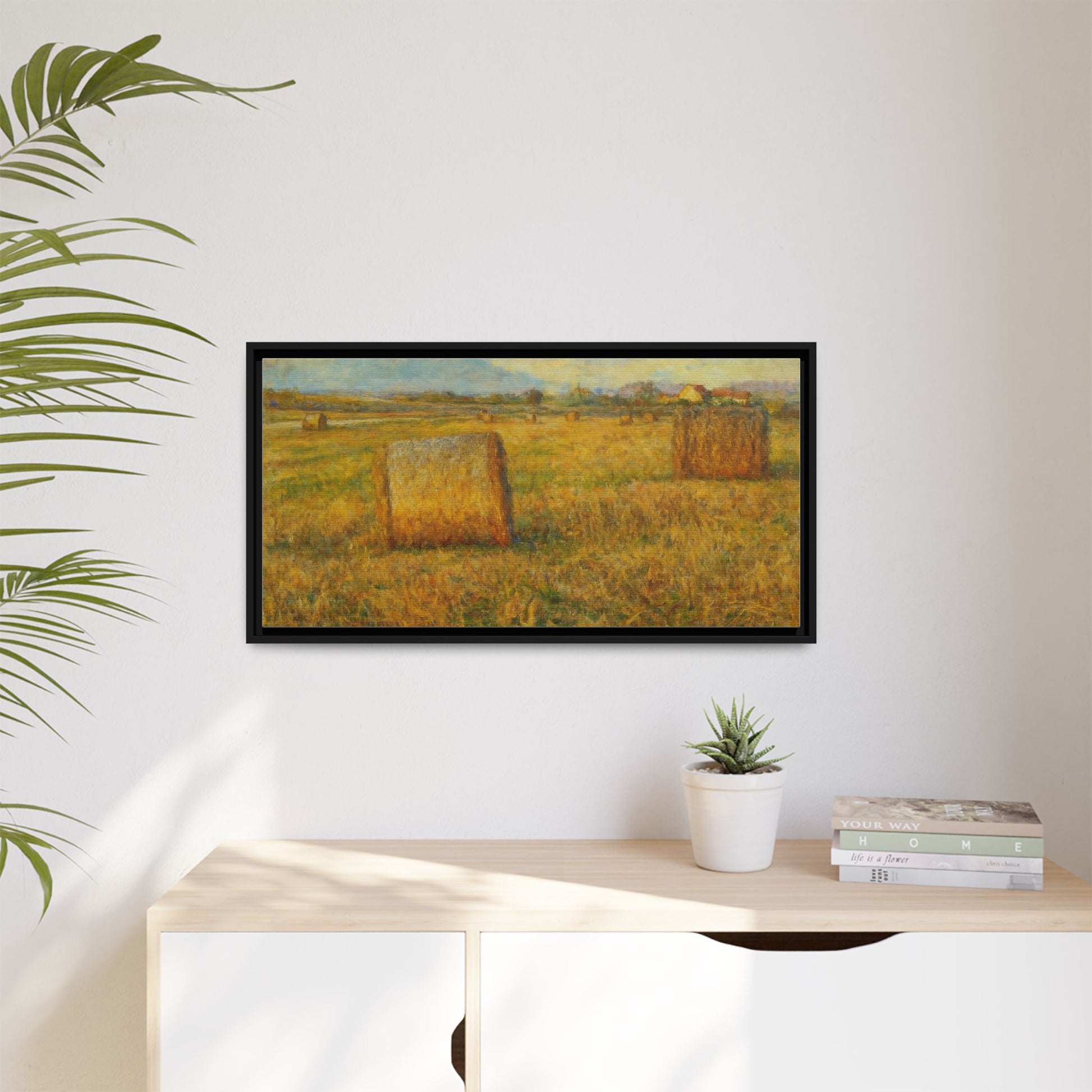 Framed matte canvas wall art featuring a rustic hayfield landscape print by Printify, suitable for rustic or farmhouse decor.