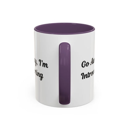 Ceramic coffee mug with "Go Away, I'm Introverting" text, 11 oz, white with black lettering, ideal for introverts.