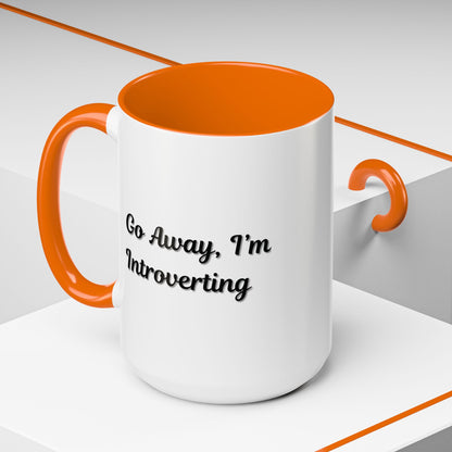 Ceramic coffee mug with "Go Away, I'm Introverting" text, 11 oz, designed for introverts, by Printify.