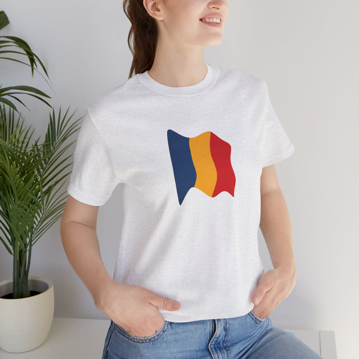 Romania flag T-shirt by Printify featuring minimal waving tricolor design on soft fabric.