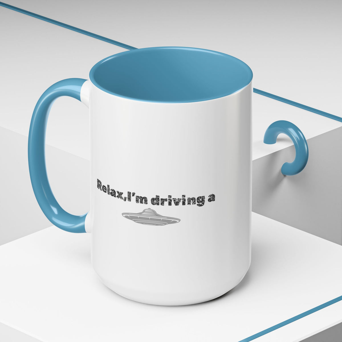 Ceramic coffee mug with "Relax, I’m Driving" UFO accent design in 11 oz size by Printify, showing the front view of the mug.
