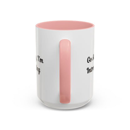Ceramic coffee mug with "Go Away, I'm Introverting" quote, 11 oz, white with black text, ideal for introverts.