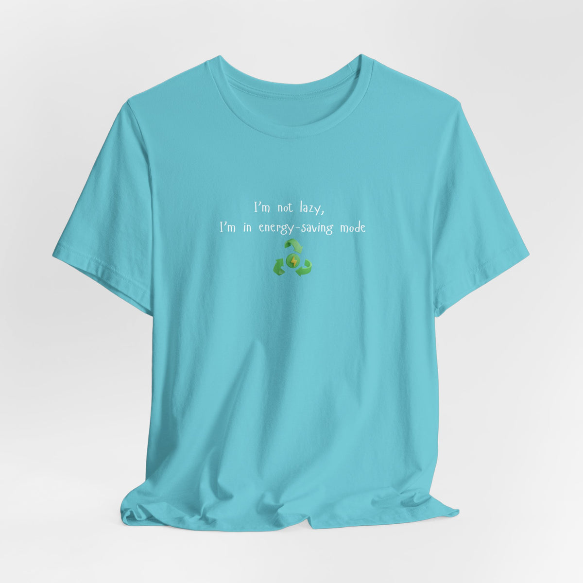 Green eco humor T-shirt with the phrase "I’m Not Lazy, I’m an Energy-Saving Mock" printed on a casual cotton tee.