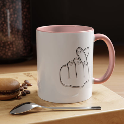 White ceramic coffee mug with minimal Korean finger heart accent design, 11oz capacity, by Printify.