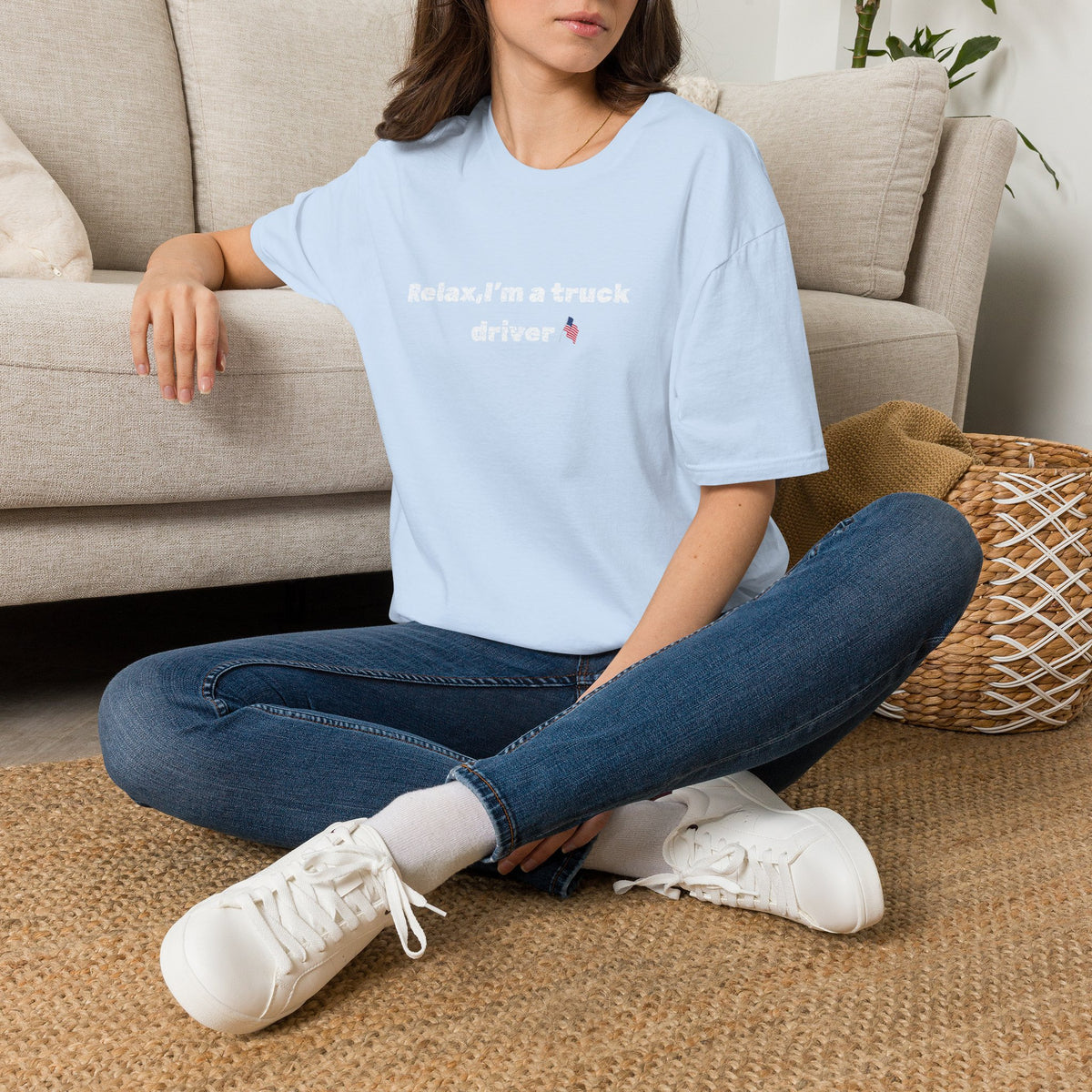 Pink heart and humorous text on a Relax, I'm a Truck Driver T-Shirt by Printify, casual trucker tee for men or women.