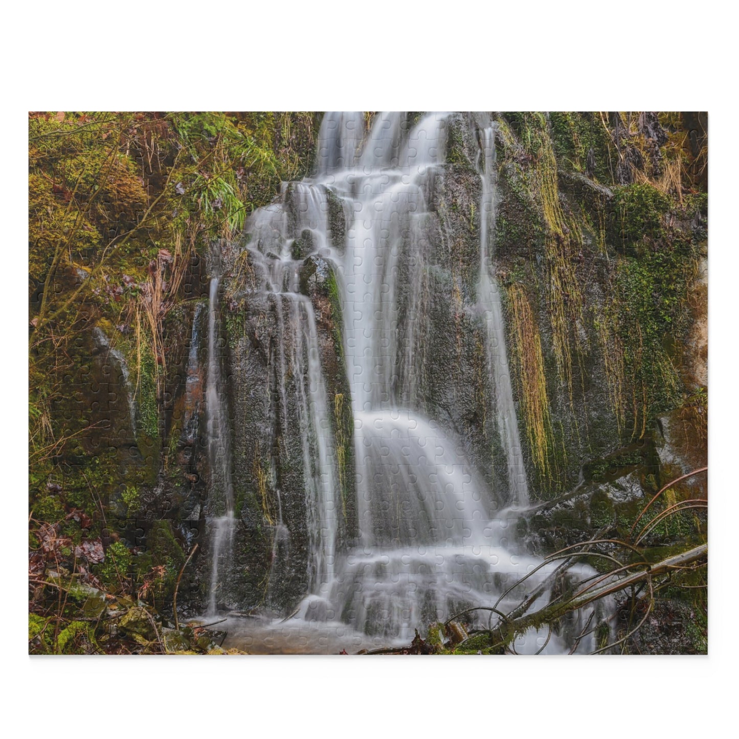 Mossy Waterfall Puzzle by Printify featuring a detailed landscape scene with lush greenery and flowing waterfall, assembled on a flat surface.