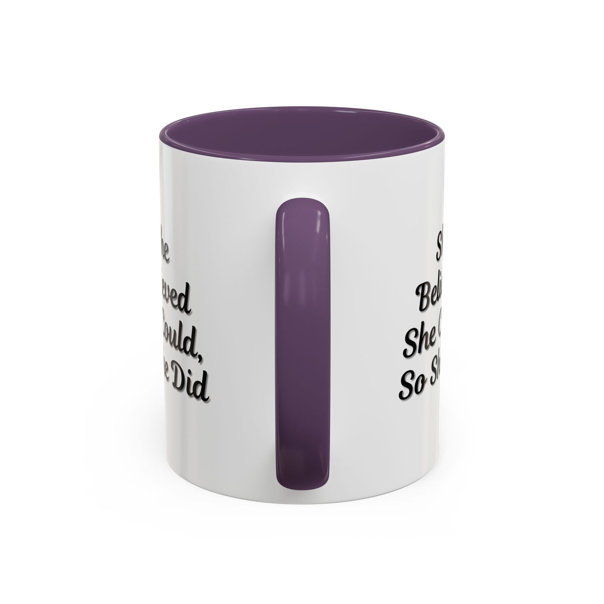 Motivational coffee mug with "She Believed She Could, So She Did" quote in black text on white ceramic mug.