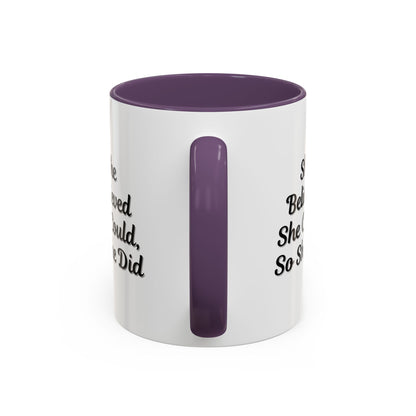 Motivational coffee mug with "She Believed She Could, So She Did" quote in black text on white ceramic mug.