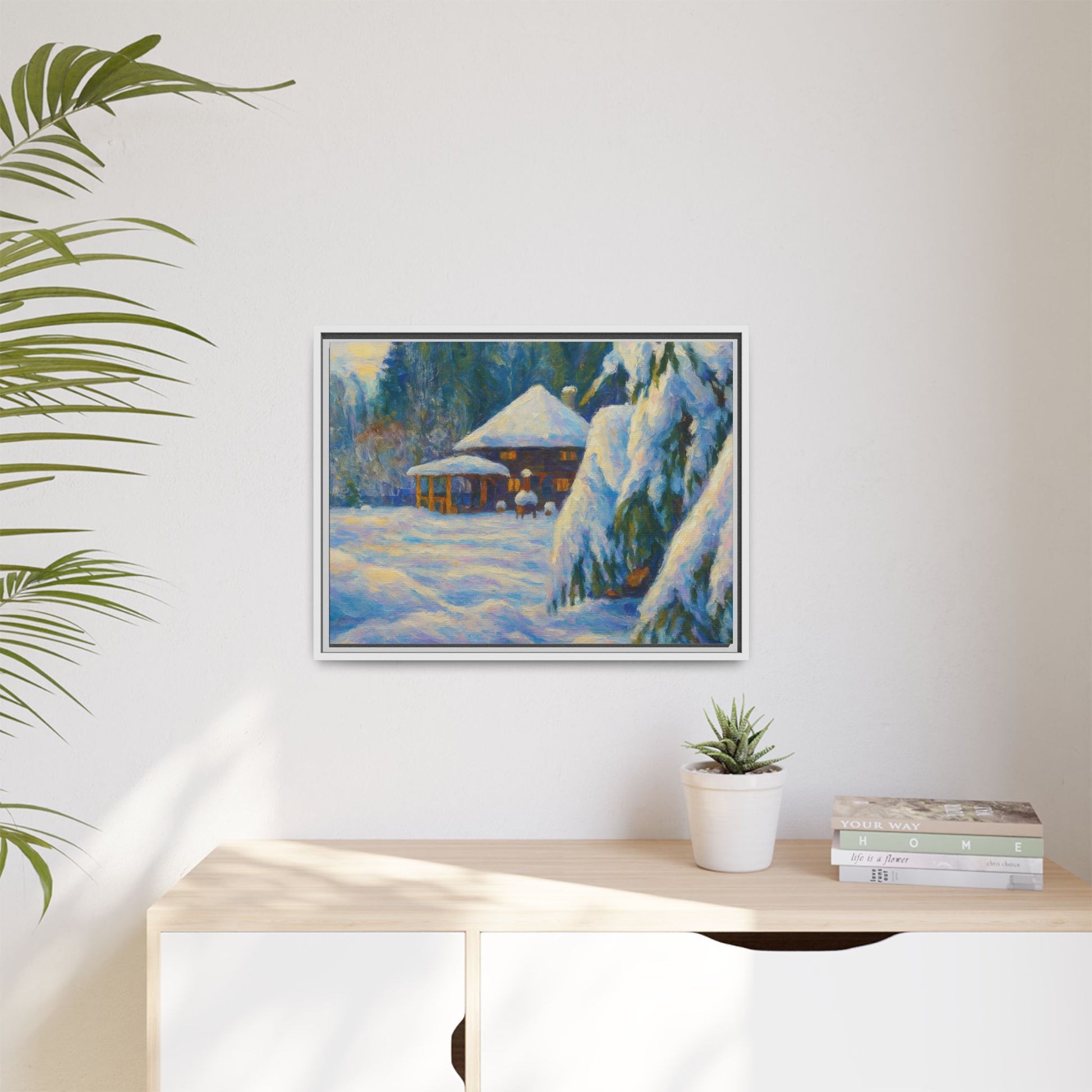 Framed matte canvas print of a snowy cabin winter landscape, featuring a cozy cabin surrounded by snow-covered trees.