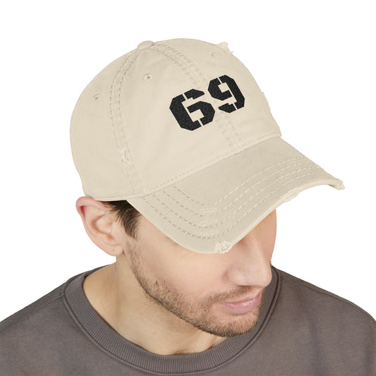 Vintage washed distressed dad hat with embroidered '69' design, stylish baseball cap by Printify featuring a casual, worn-in look.