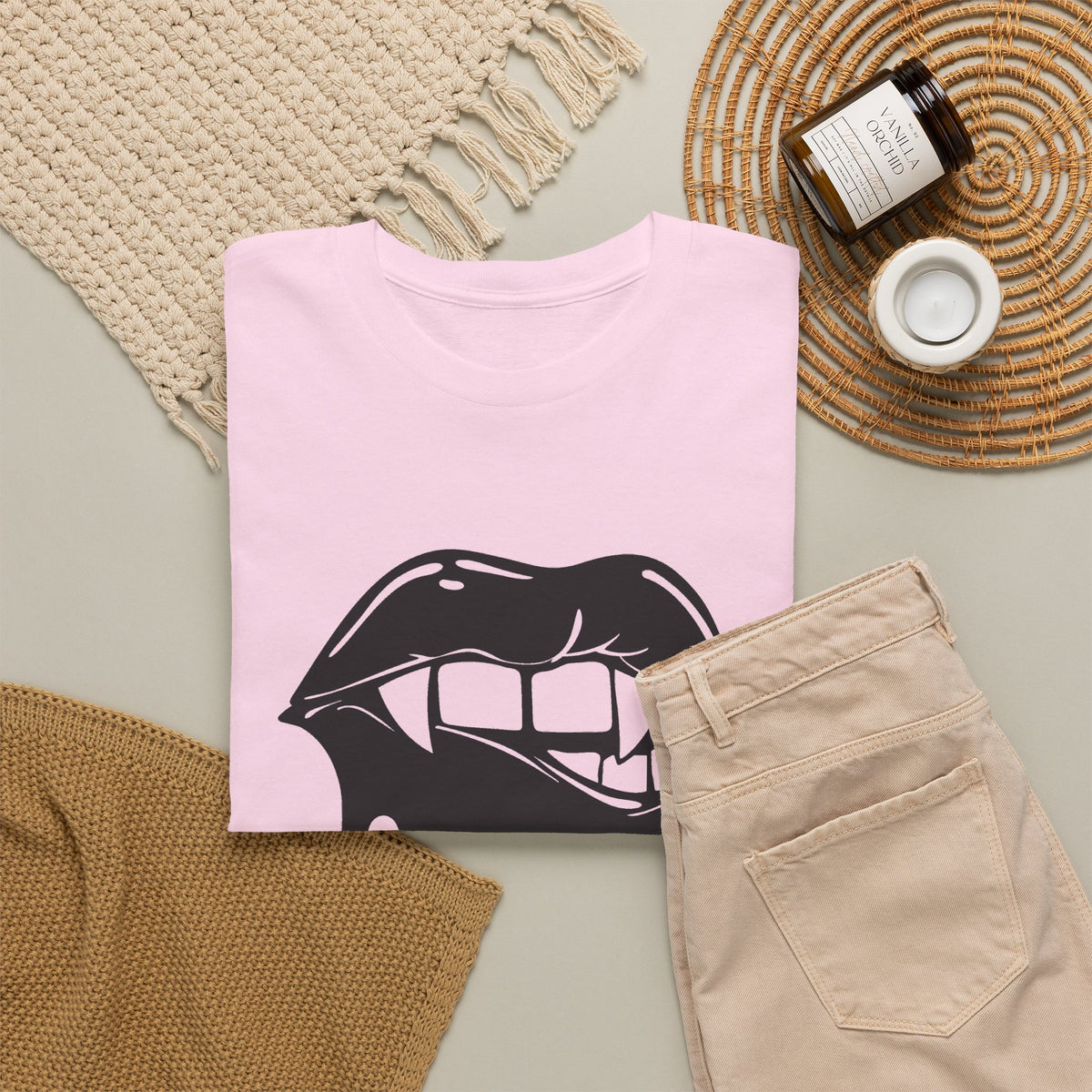 Graphic T-shirt featuring a dripping lips "hmm..." bite design in bold print, by Printify, shown on a casual model.