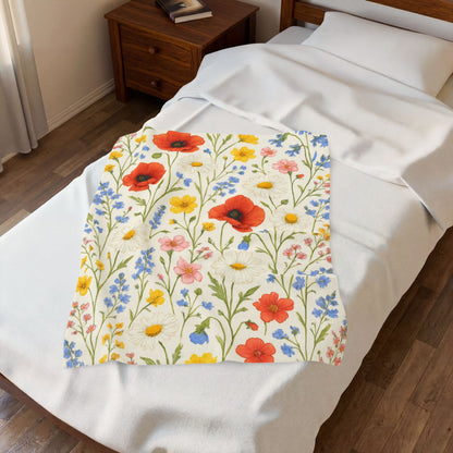 Velveteen plush blanket with all-over wildflower meadow and poppy daisy floral print, soft and cozy for home decor.
