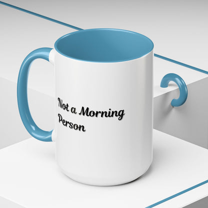 Ceramic coffee mug with "Not a Morning Person" print in 11oz or 15oz size, featuring a white background and bold black lettering.