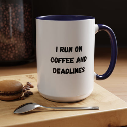 White ceramic coffee mug with "I Run on Coffee and Deadlines" printed in black text, ideal for office or home use.