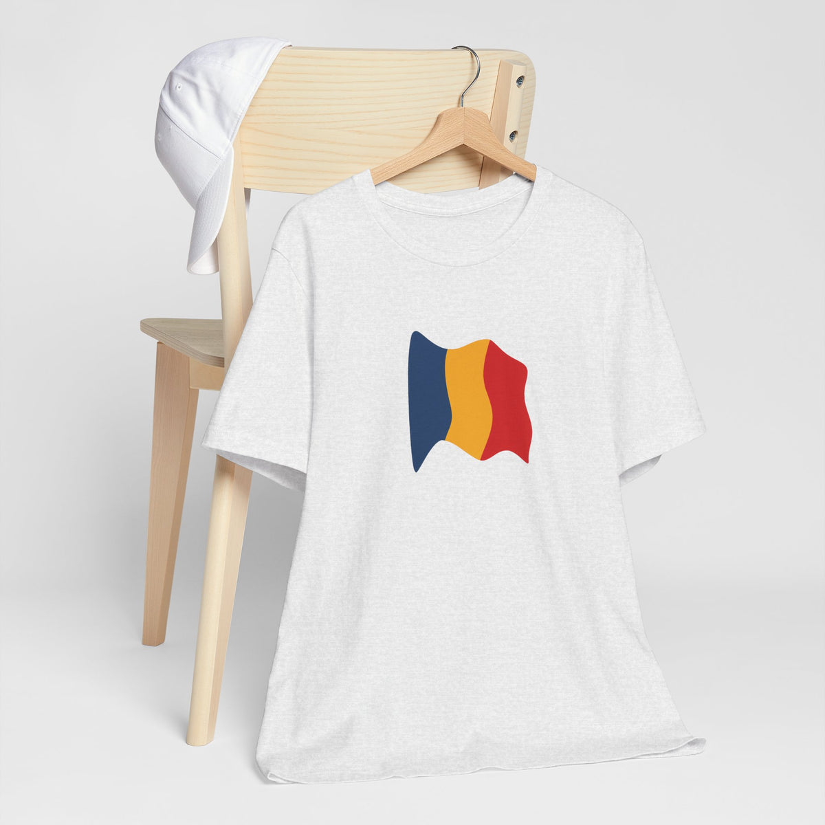 Romania flag T-Shirt by Printify featuring a minimal waving tricolor design on a casual cotton tee.