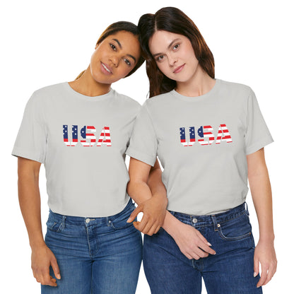 USA flag text T-shirt by Printify with patriotic Fourth of July design, featuring bold red, white, and blue colors.