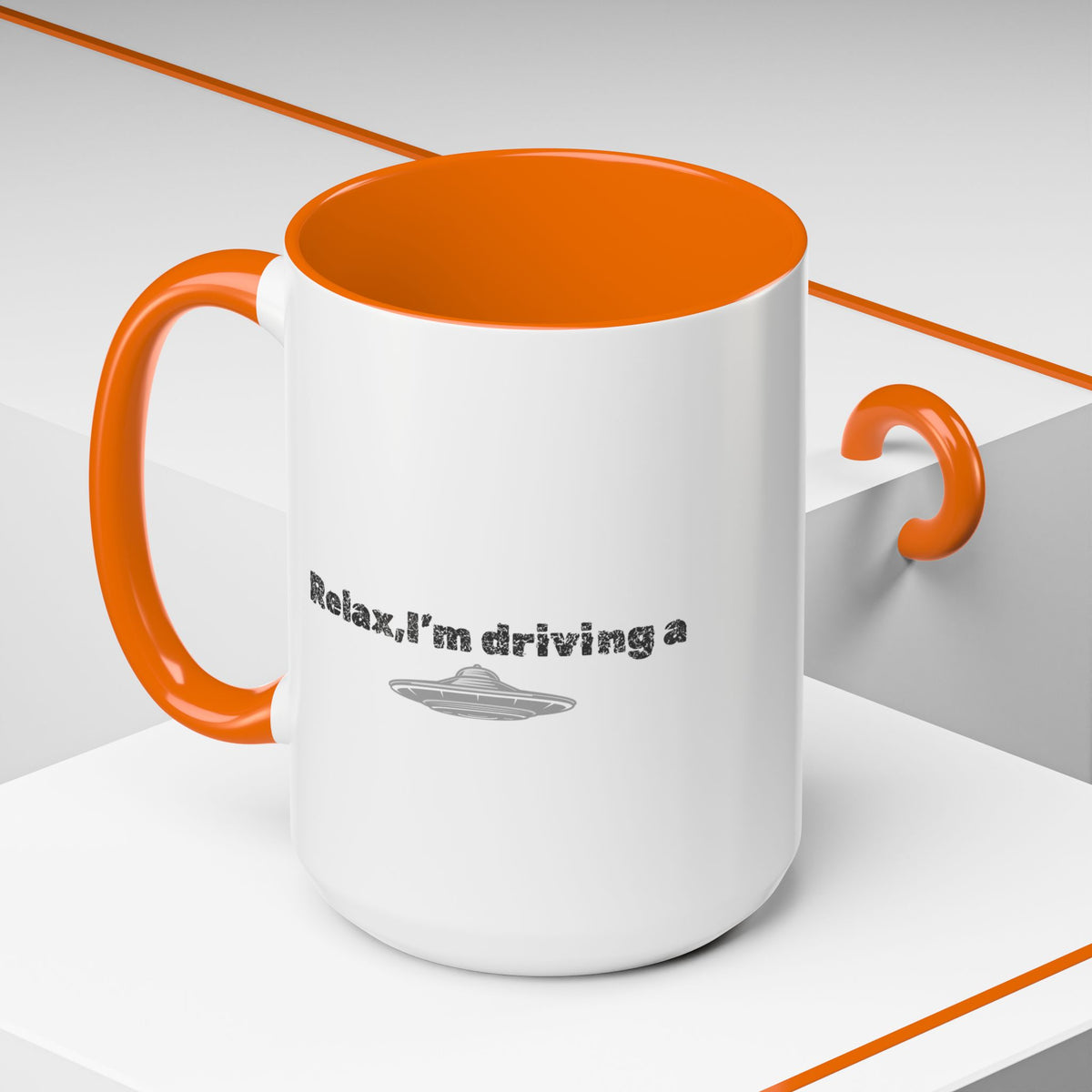 Ceramic coffee mug with "Relax, I’m Driving" UFO accent design, available in 11 or 15 oz, by Printify.
