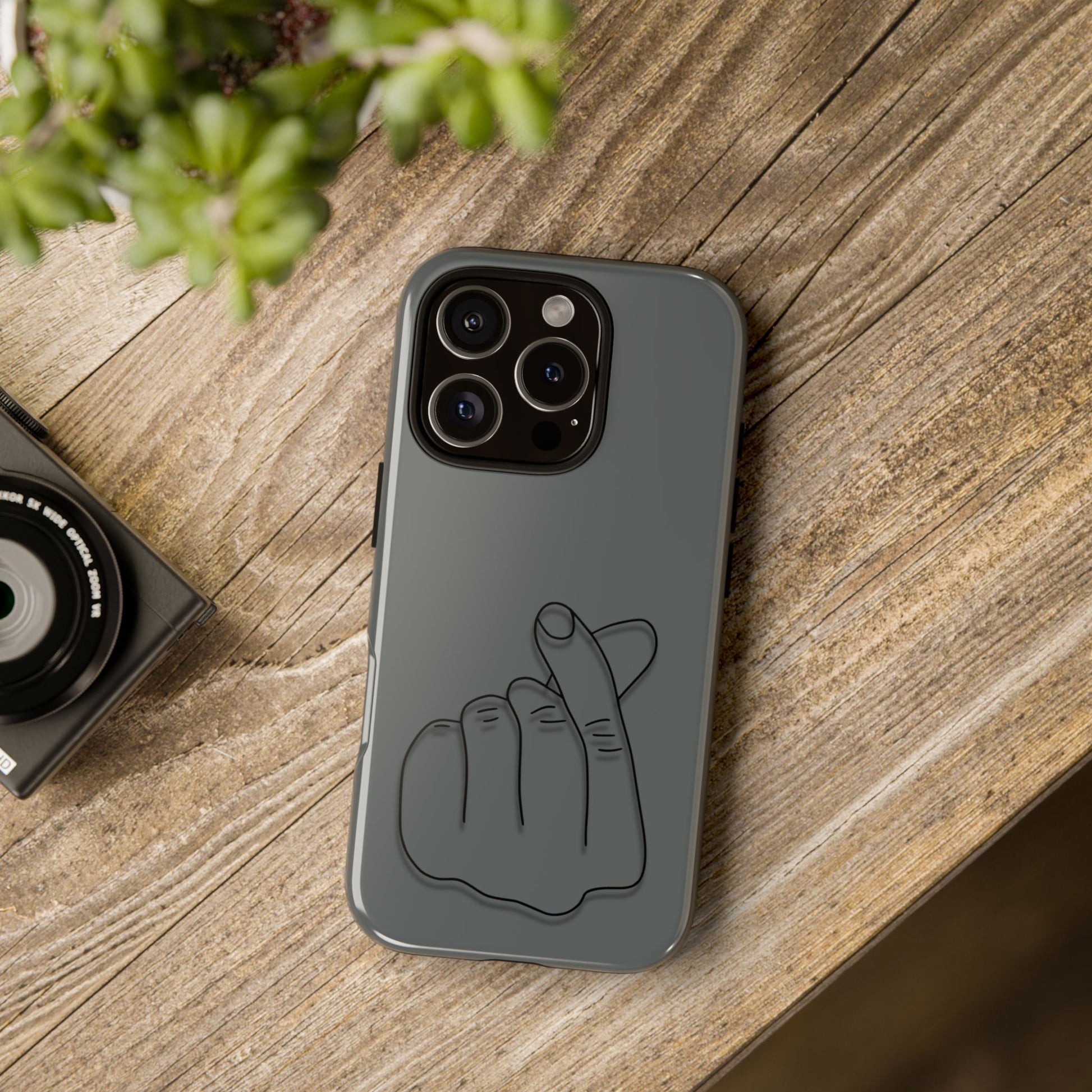Silicone phone case with embossed Korean finger heart design, compatible with smartphones, by Printify.