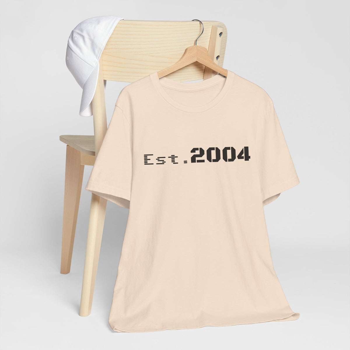 Minimal vintage Est. 2004 T-Shirt by Printify, featuring a classic design celebrating the birth year with simple style.