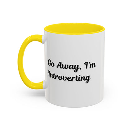 Ceramic coffee mug with "Go Away, I'm Introverting" text in black on white, 11 oz size, ideal for introverts.