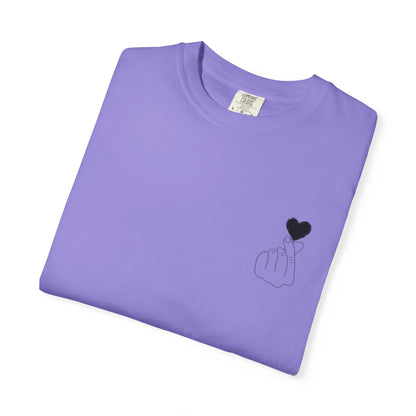 Black T-shirt with a minimal finger heart graphic design, featuring a small black heart on the front, by Printify.