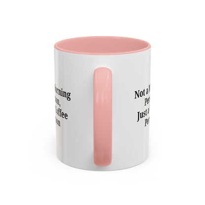 Ceramic coffee mug with the phrase "Not a Morning Person, Just a Coffee Person" in black text, on a white background.