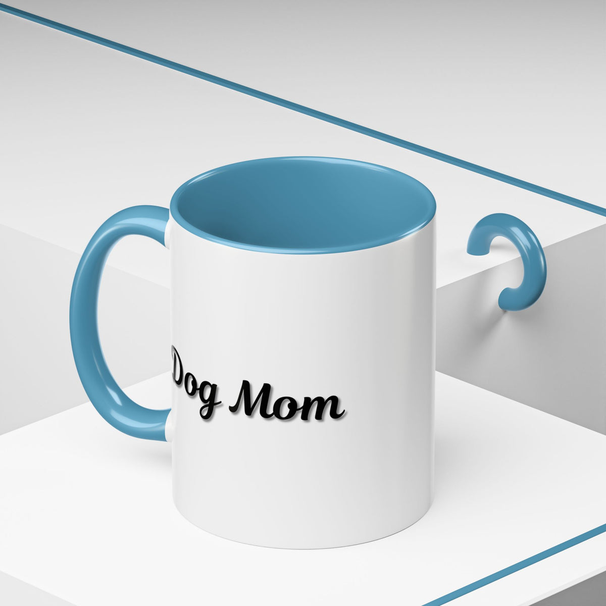 Dog Mom Accent Coffee Mug — white ceramic coffee mug with retro script "Dog Mom" print, colored interior and C-handle, 11oz/15oz, styled lifestyle product photo