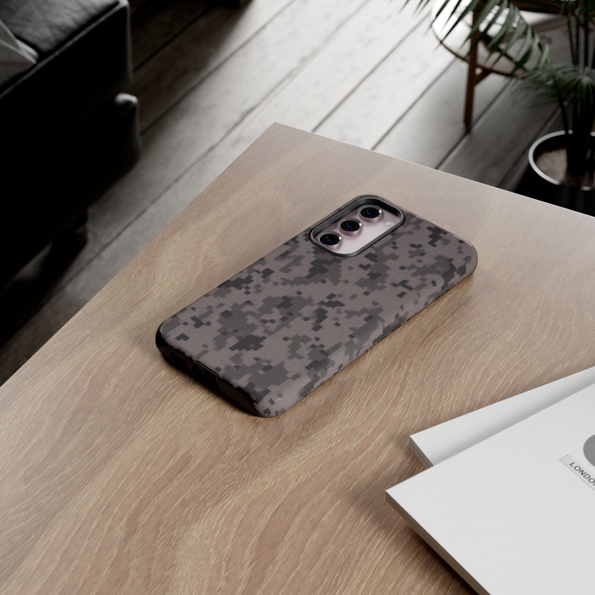 Gray digital camouflage phone case from Printify, tough protective cover for smartphones with a rugged camo design.